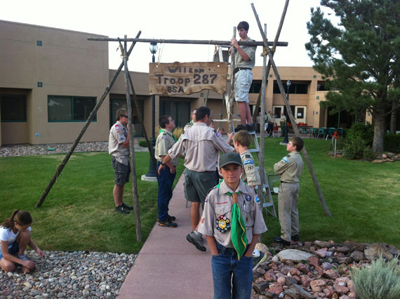 The boys build their camp entrance before Court of Honor